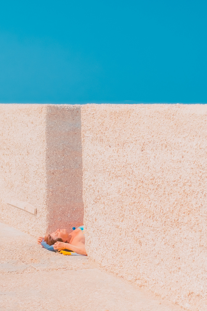 Blue Sky Sunbather by Roberto Ruoli — canvas wall art