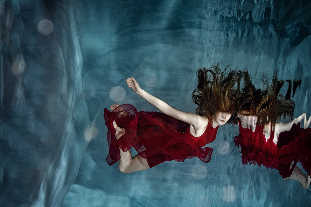 Woman In Red Underwater by Petr Kleiner — canvas wall art