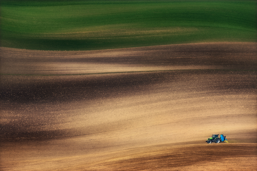 Tractor in Rolling Fields by Vlad Sokolovsky — canvas wall art