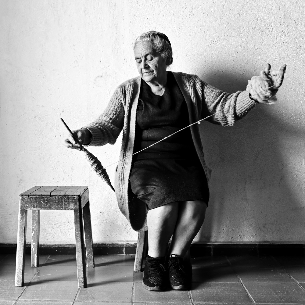 Elderly Woman Spinning by Cesar Tejada — canvas wall art