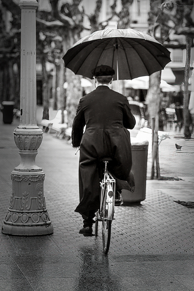Man Cycling in Rain by Jesus Concepcion Alvarado — canvas wall art