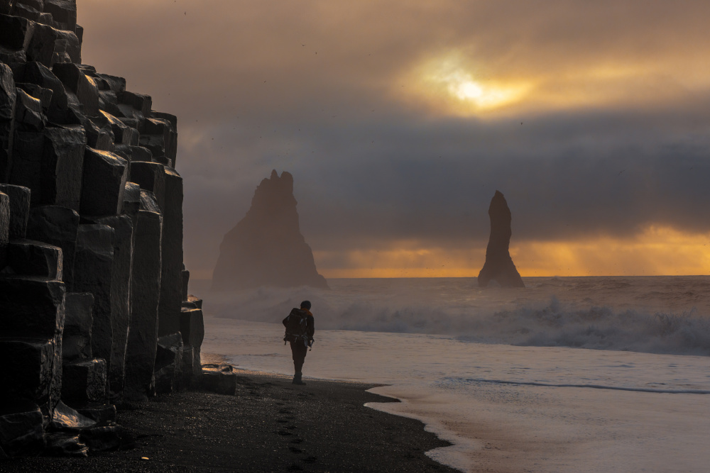 Lone Figure Black Sand Beach by Rune Askeland — canvas wall art