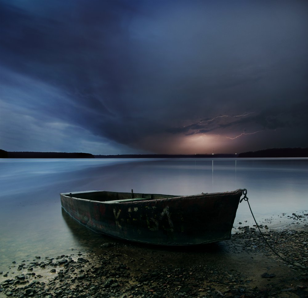 Night Storm Boat by Mindaugas Žarys — canvas wall art