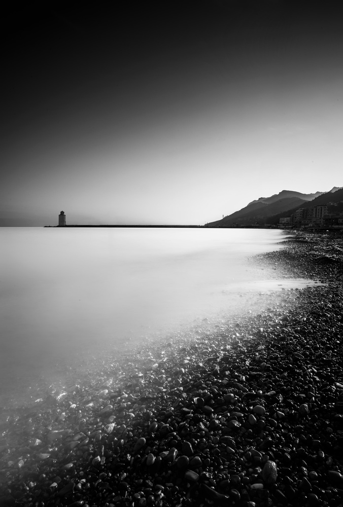 Lighthouse Over Calm Water by Oussama Mazouz — canvas wall art