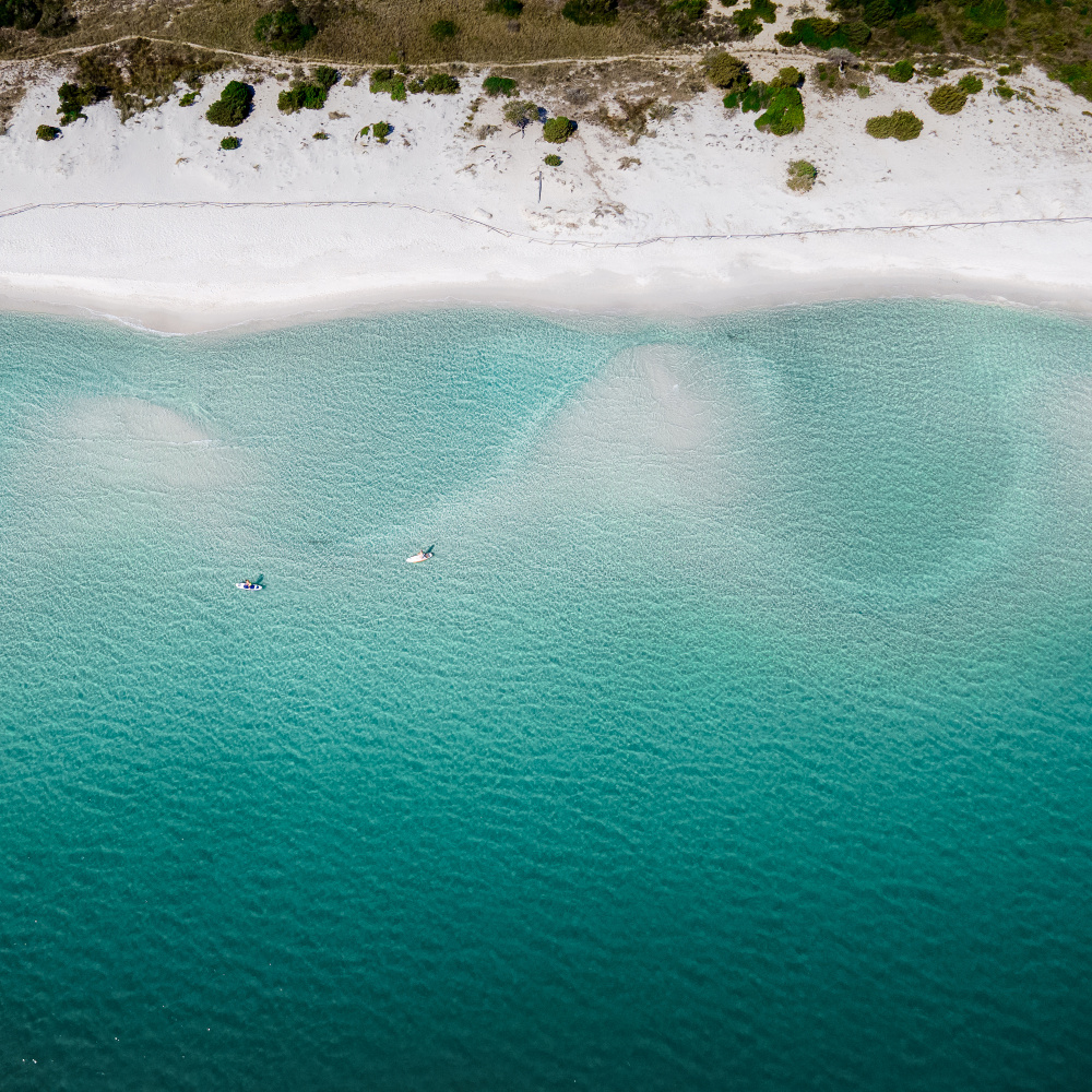 Pristine Beach Paddleboarding by Anna Kirchner — canvas wall art