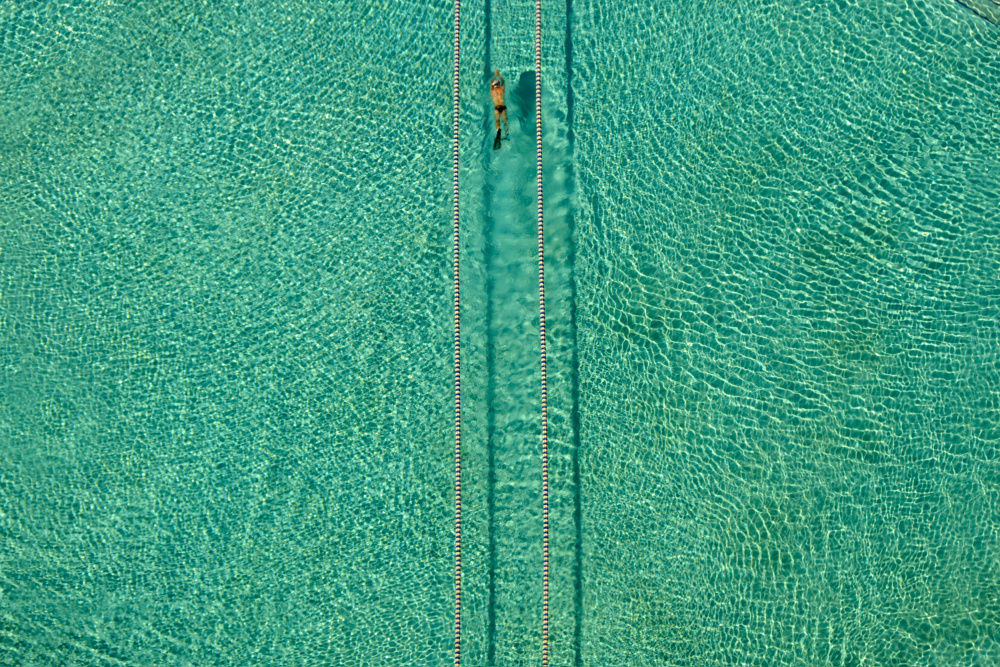 Turquoise Pool Swimmer by Hossein Nikzad Amoli — canvas wall art