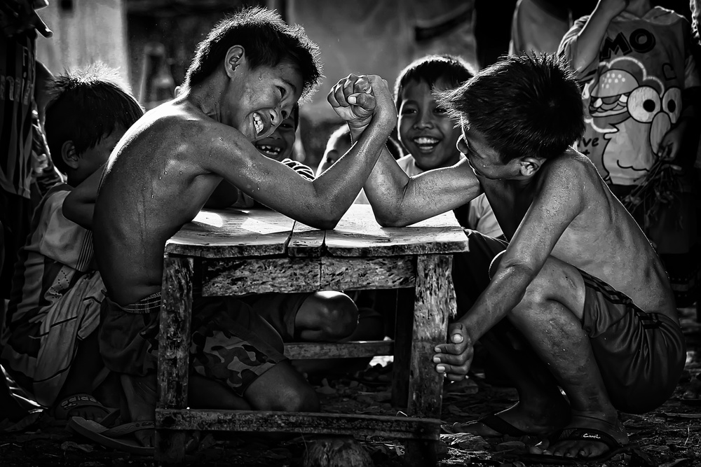 Joyful Arm Wrestling Match by Adhi Prayoga — canvas wall art