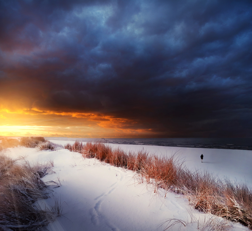 Lone Figure Winter Sunset by Mindaugas Žarys — canvas wall art