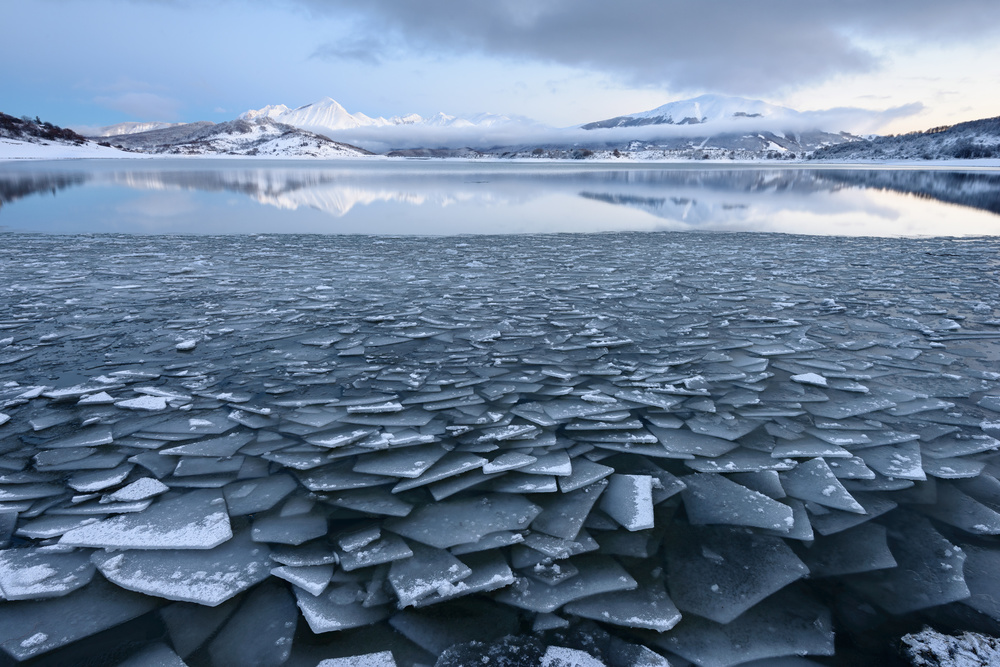 Icy Mountain Lake Reflection by Riccardo Lucidi — canvas wall art
