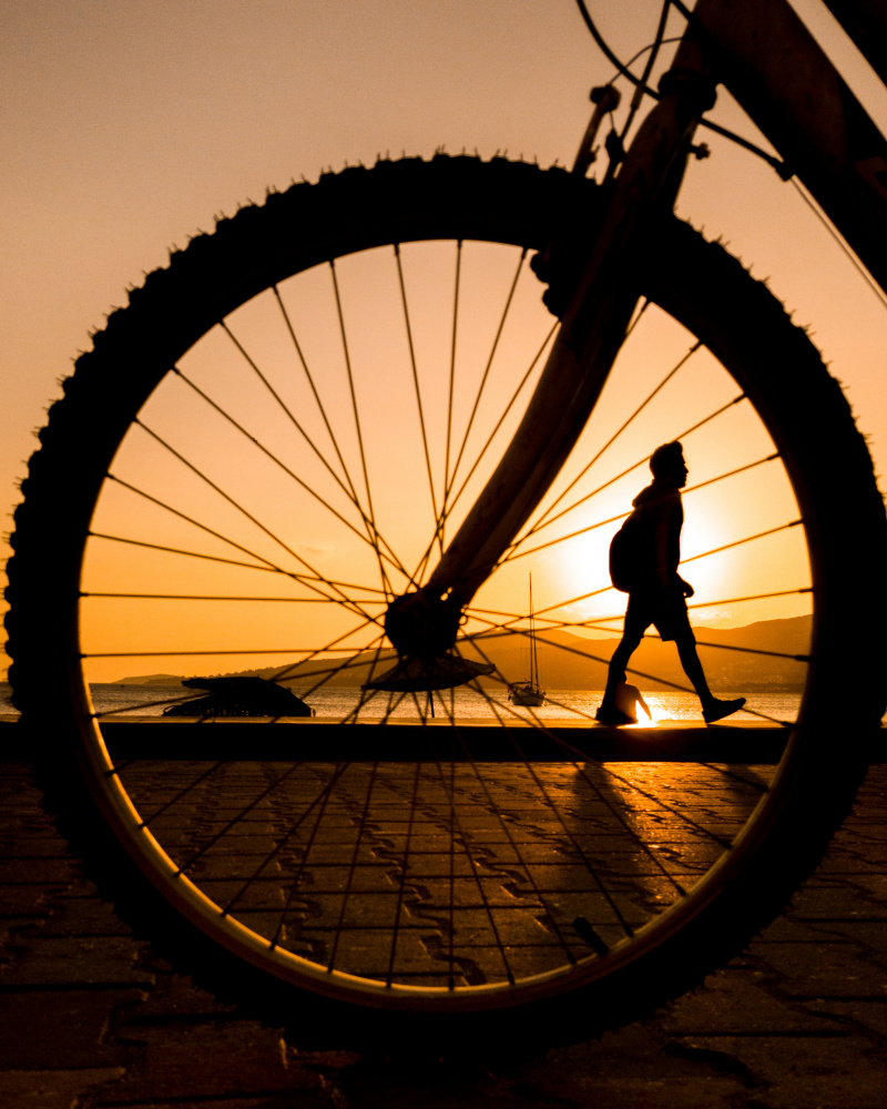 Sunset Bicycle Journey by Doruk Uysal — canvas wall art