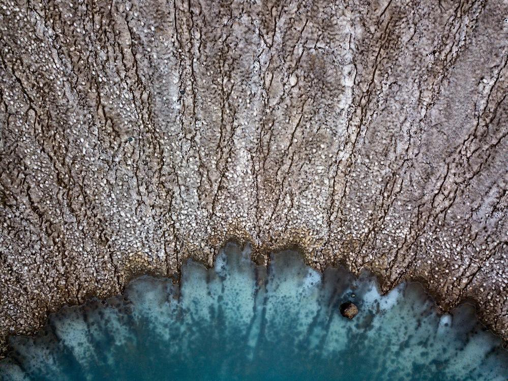Cracked Earth Blue Water by Alexey Kharitonov — canvas wall art