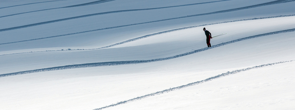Lone Skier Winter Slope by Matej Rumansky — canvas wall art