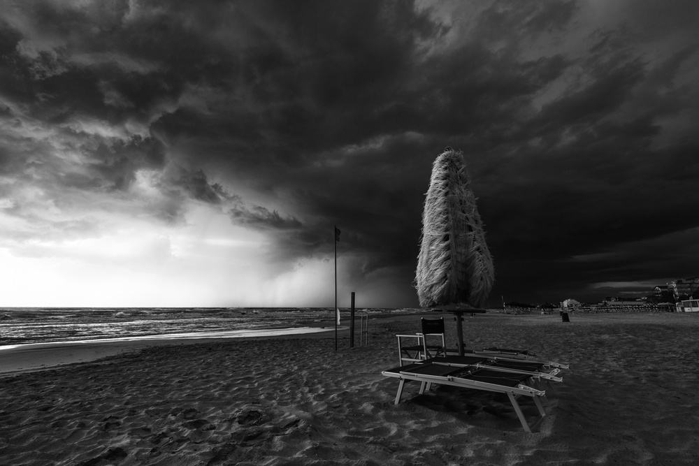 Stormy Beach Umbrella by Riccardo Lucidi — canvas wall art