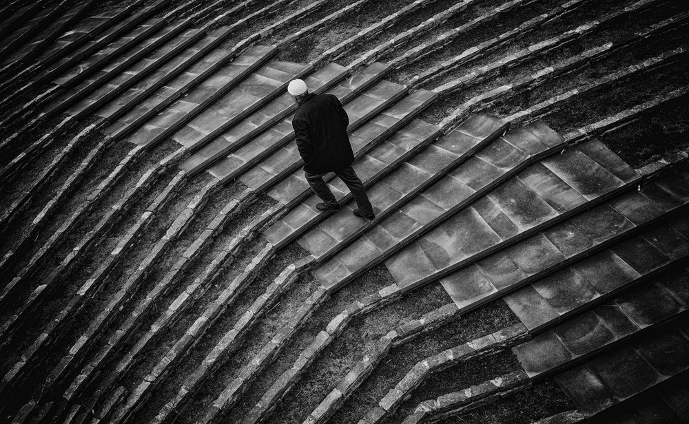 Solitary Man Ascending Steps by ihyabozkurt — canvas wall art