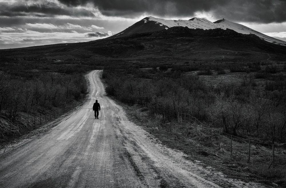 Lone Figure Mountain Road by Yavuz Pancareken — canvas wall art