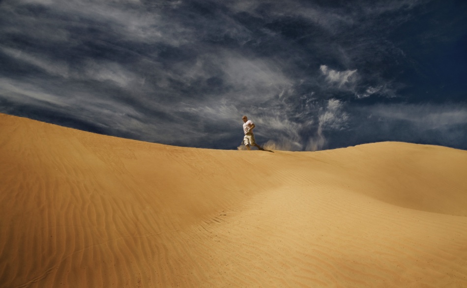 Man On Desert Dune by Marcus Bj [ Ö ] rkman — canvas wall art