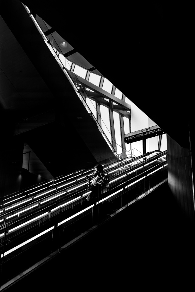 Person on Modern Escalator by Yuzo Fujii — canvas wall art