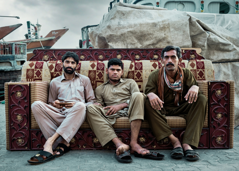 Three Men on an Ornate Sofa by Michael Schnabl — canvas wall art