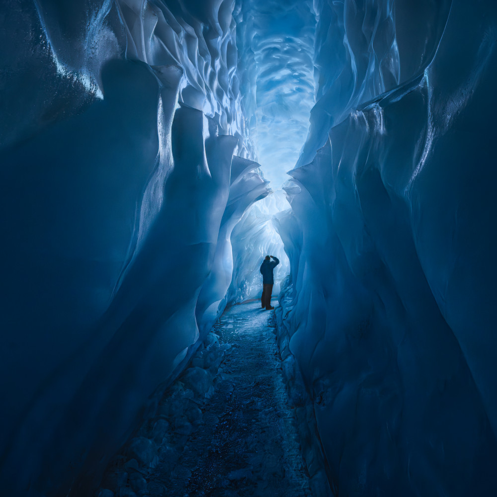 Blue Ice Cave Explorer by Leah Xu — canvas wall art