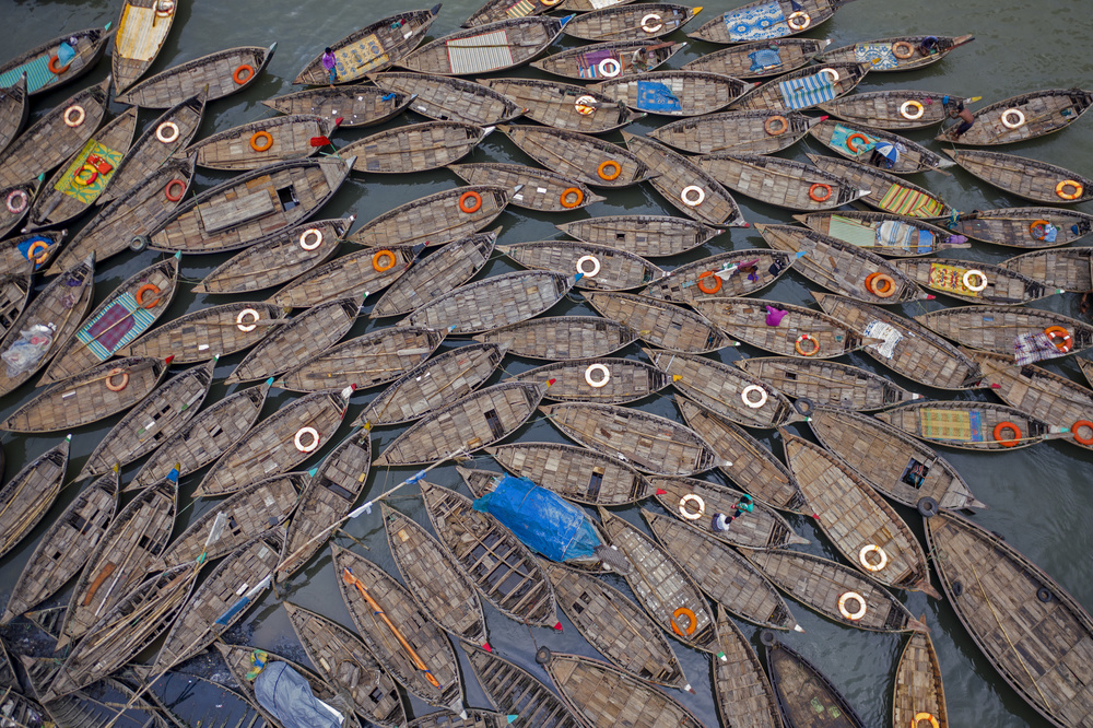 Crowded Wooden Boats by Azim Khan Ronnie — canvas wall art