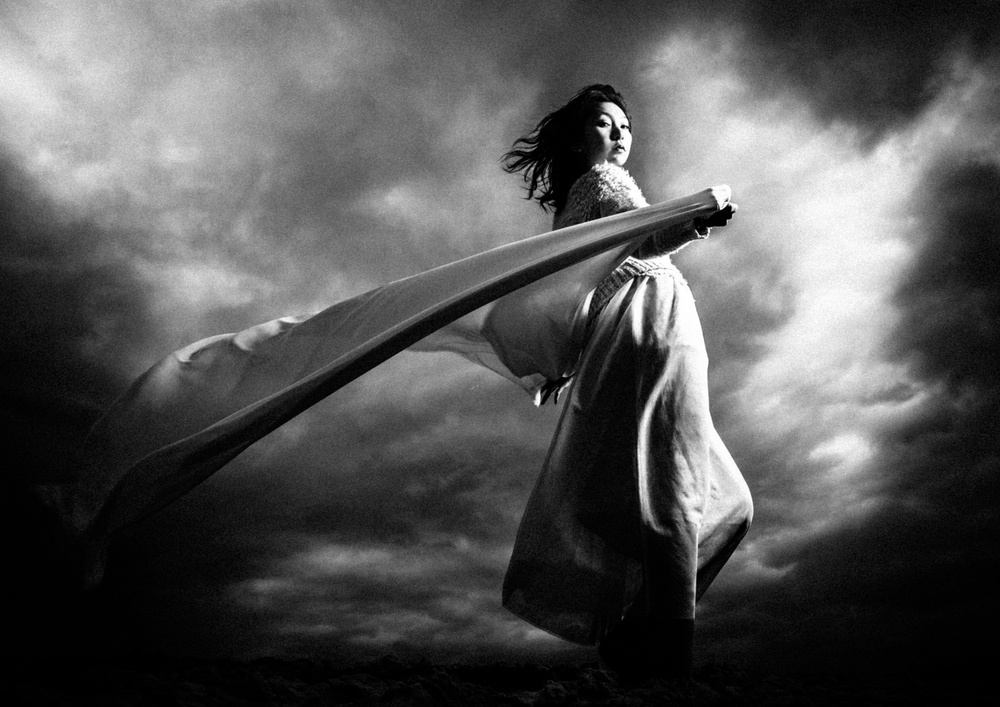 Woman Under Stormy Sky by TORU MATSUNAGA — canvas wall art