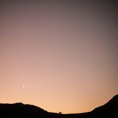 Moon Above Silhouetted Hills