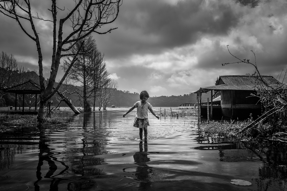 Child In Water Village by Gunarto Song — canvas wall art