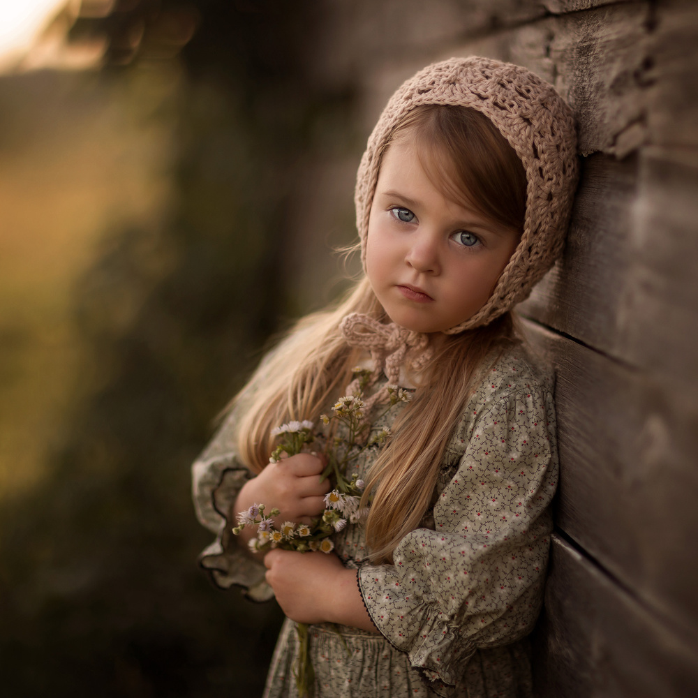Pensive Girl Holding Flowers by Annie Whitehead — canvas wall art