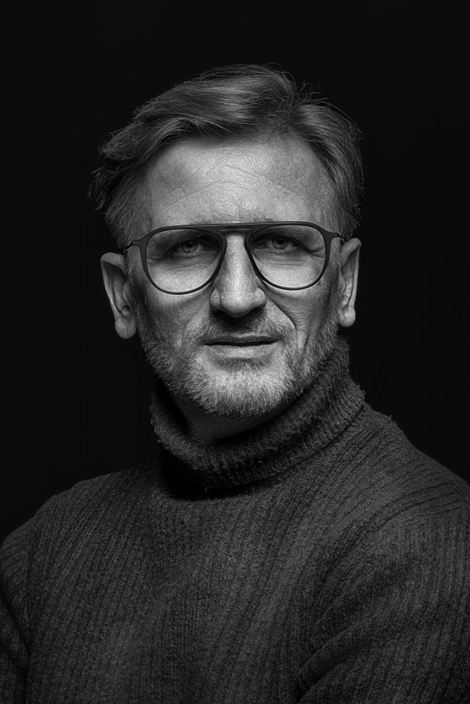 Thoughtful Man in Glasses by Dariusz Budyta — canvas wall art