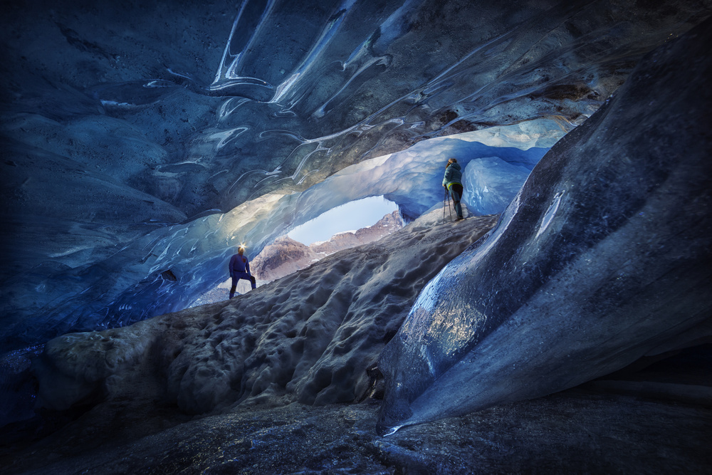 Exploring Blue Ice Cave by Clara Gamito — canvas wall art