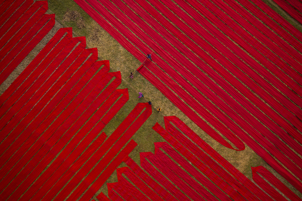 Vibrant Red Fabric Fields by Azim Khan Ronnie — canvas wall art