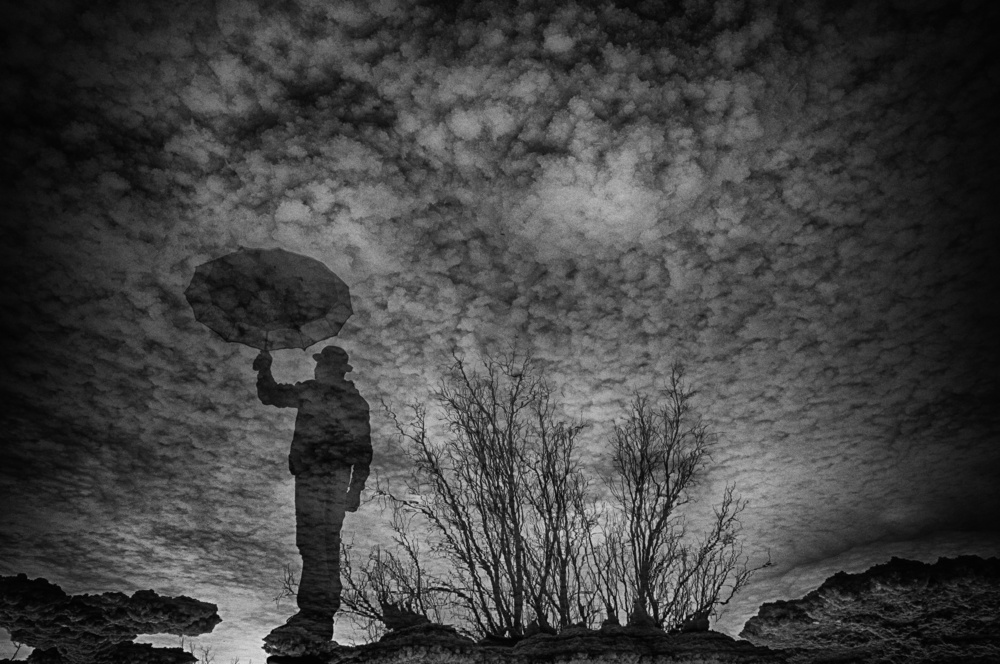 Reflected Umbrella Man by Miki Meir Levi — canvas wall art
