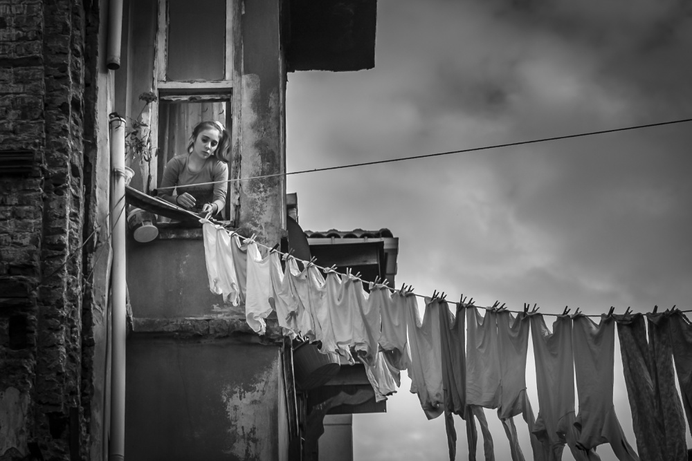 Woman at Window by Tunc Tuncel — canvas wall art