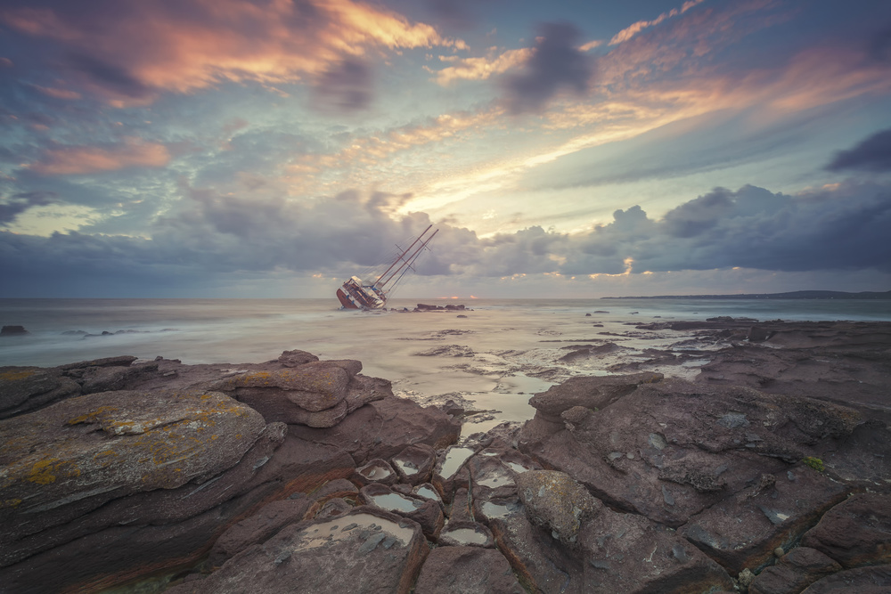 Sunset Shipwreck on Rocks by Daniele Atzori — canvas wall art