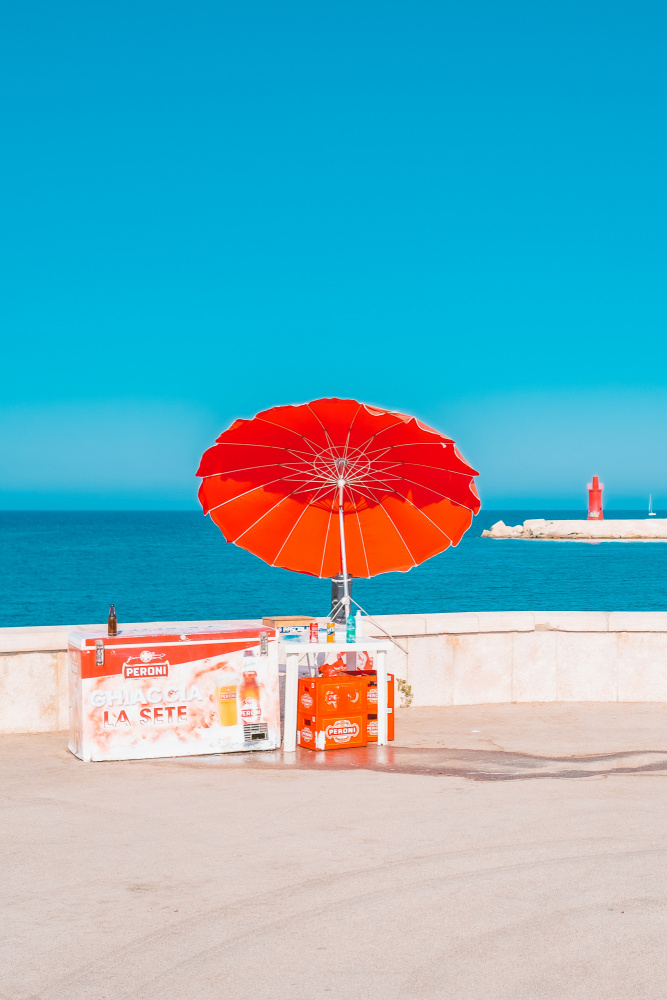 Red Umbrella Ocean View by Roberto Ruoli — canvas wall art