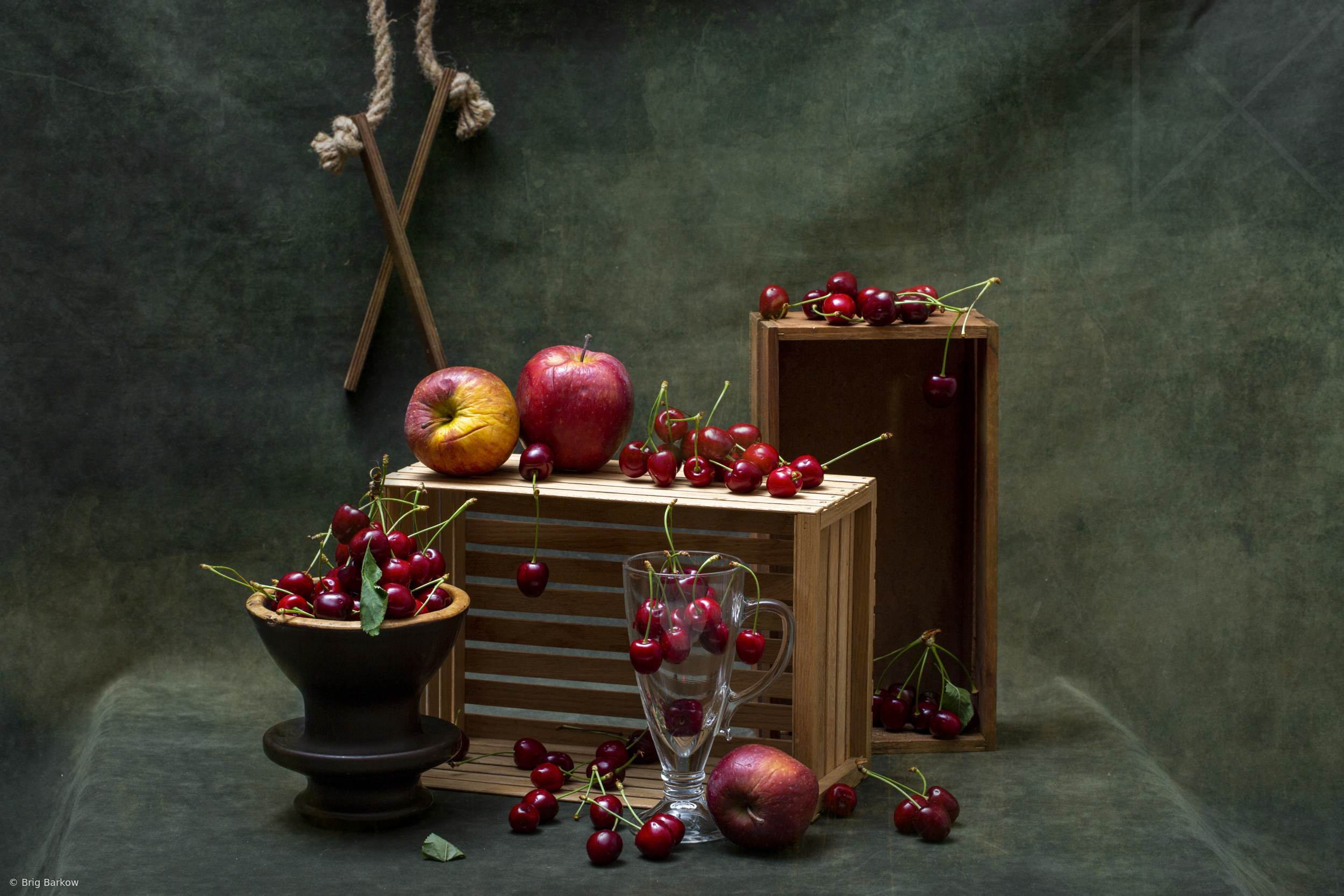 Single Ripe Apple Still life with ripe apples and red cherries by Brig Barkow