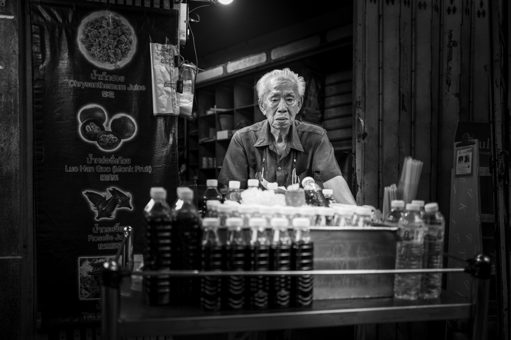 Elderly Street Vendor by Alan Kwang — canvas wall art