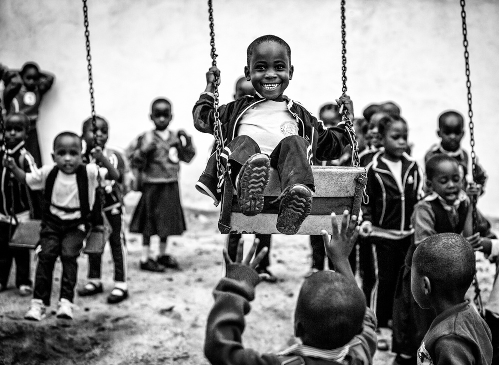 Smiling Boy On Swing by Vedran Vidak — canvas wall art