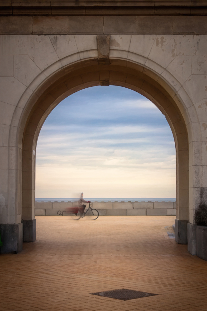 Cyclist Through Archway by Bruno Flour — canvas wall art