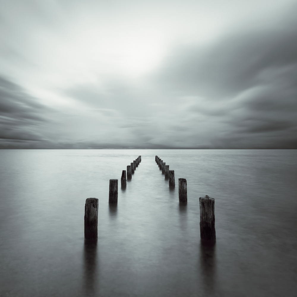 Moody Ocean Pilings by Alexej Schulz — canvas wall art
