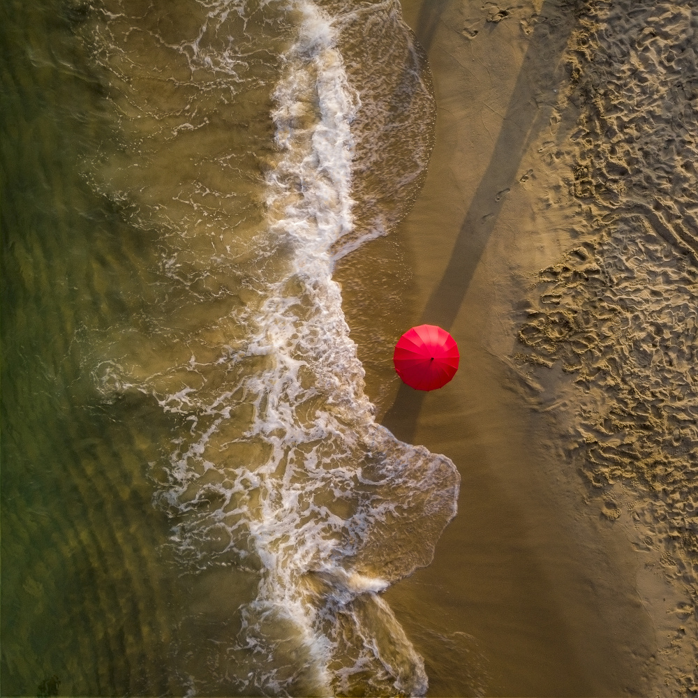 Solitary Beach Umbrella by Chiranjib Chakraborty — canvas wall art