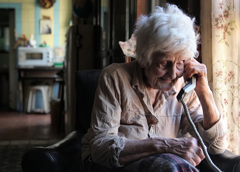 Smiling Elder on Phone by Ellen van Deelen — canvas wall art