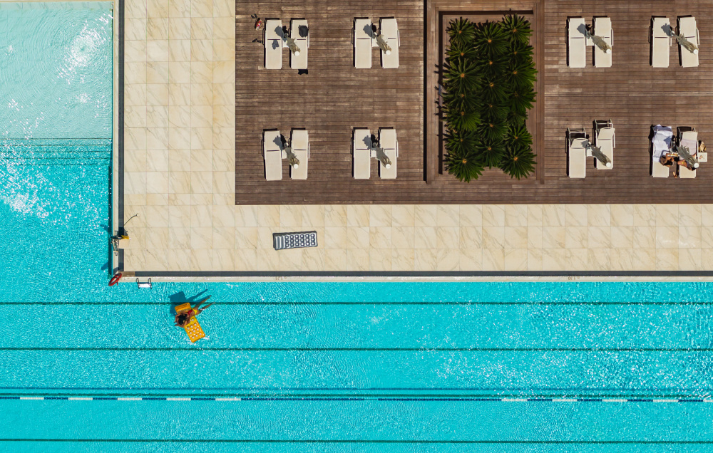 Sunny Resort Pool View by Joshua Raif — canvas wall art
