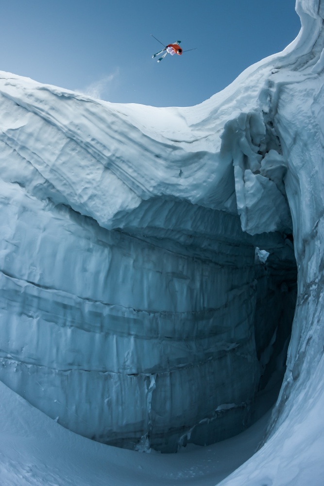 Skier Leaping Ice Chasm by Tristan Shu — canvas wall art
