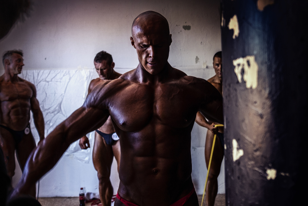 Focused Bodybuilder Strength by Petr Kleiner — canvas wall art